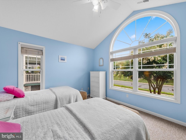 carpeted bedroom with lofted ceiling and ceiling fan