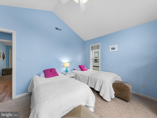 bedroom with vaulted ceiling, carpet flooring, and ceiling fan