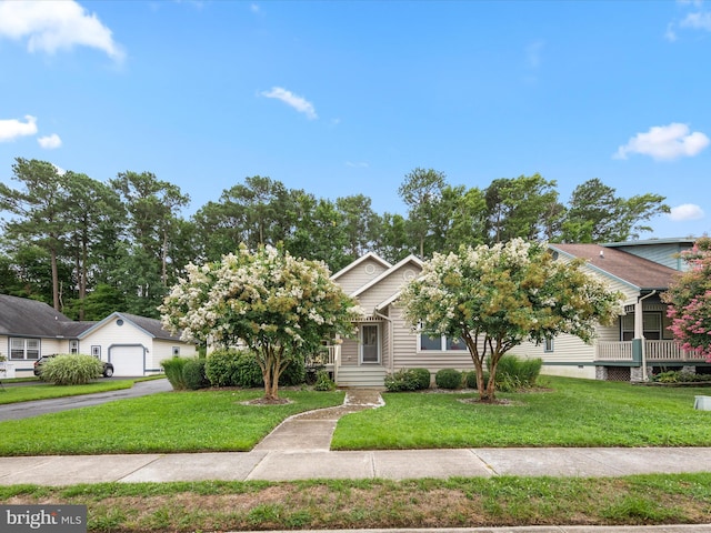 obstructed view of property featuring a front lawn