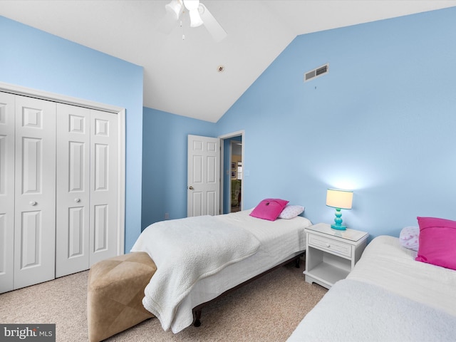 bedroom featuring high vaulted ceiling, a closet, ceiling fan, and carpet