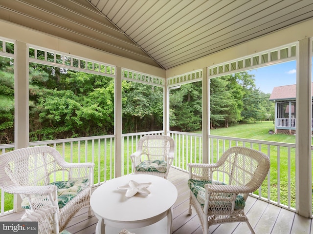 sunroom / solarium featuring lofted ceiling and wooden ceiling