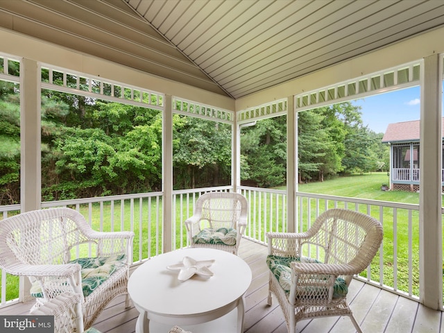 wooden terrace with a lawn