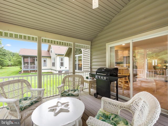 sunroom / solarium with lofted ceiling