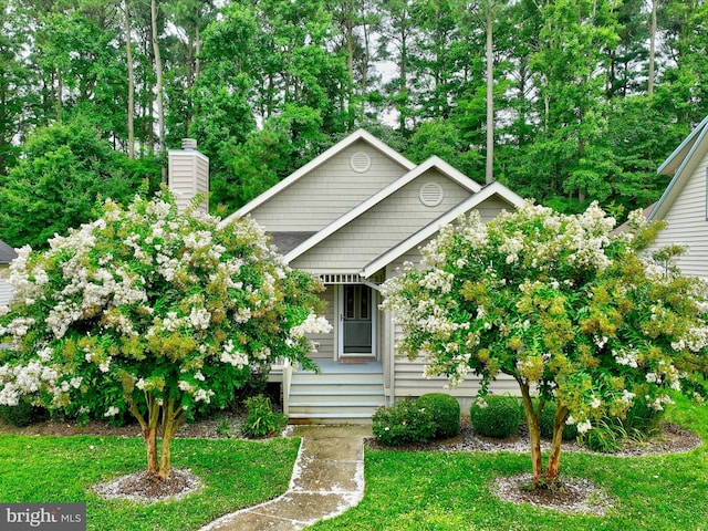 view of front of home with a front yard