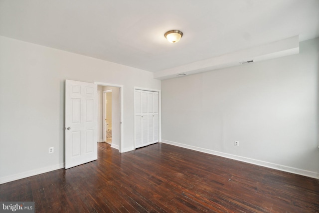 empty room featuring dark wood-type flooring