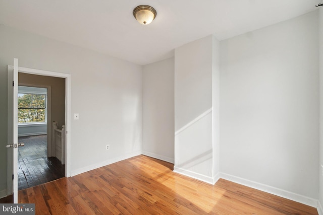 empty room featuring wood-type flooring