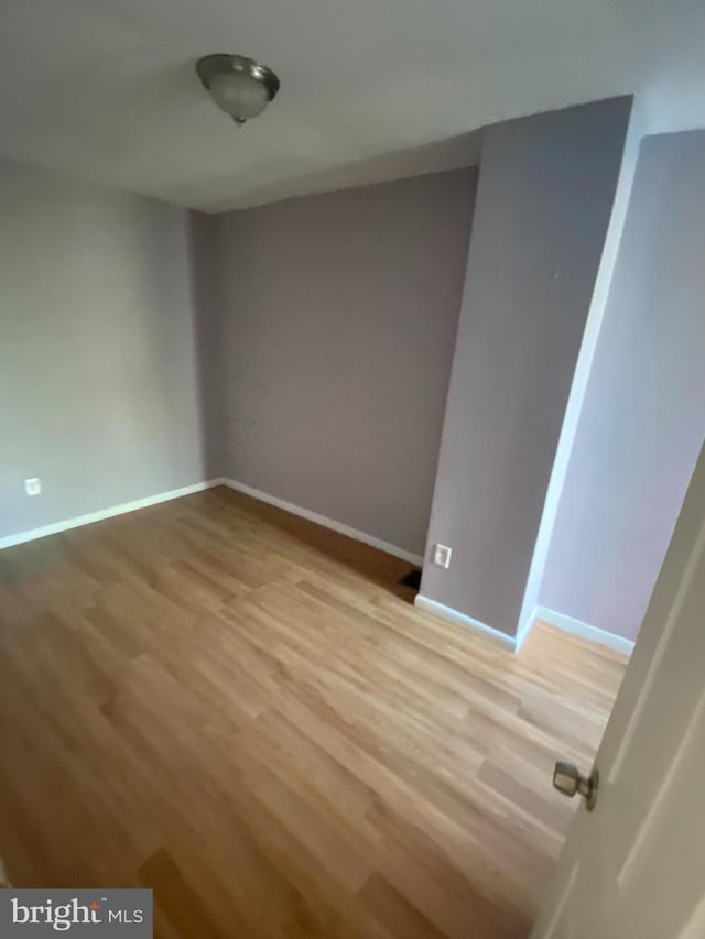 empty room featuring hardwood / wood-style floors