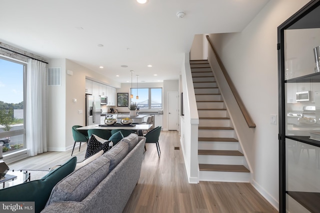 living room with light hardwood / wood-style flooring