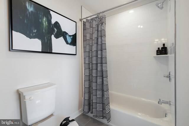 bathroom with tile patterned floors, toilet, and shower / bath combo