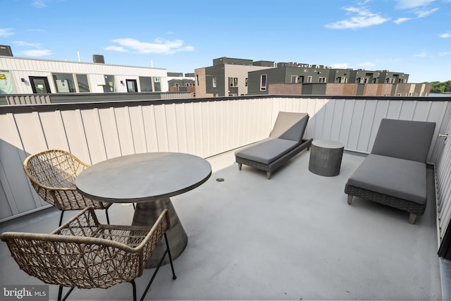 view of patio featuring a balcony