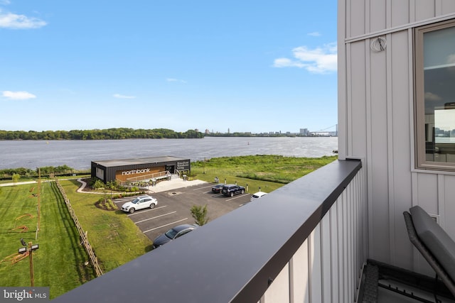 balcony featuring a water view