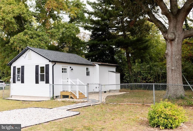 view of side of home featuring a yard