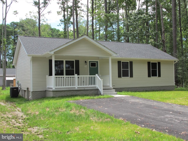 ranch-style home with cooling unit and covered porch