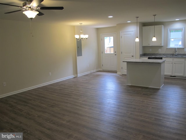 kitchen with dark wood-type flooring and white cabinetry