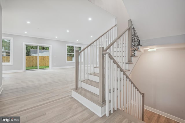 stairway with hardwood / wood-style flooring