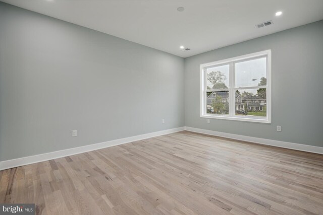 unfurnished room featuring light wood-type flooring