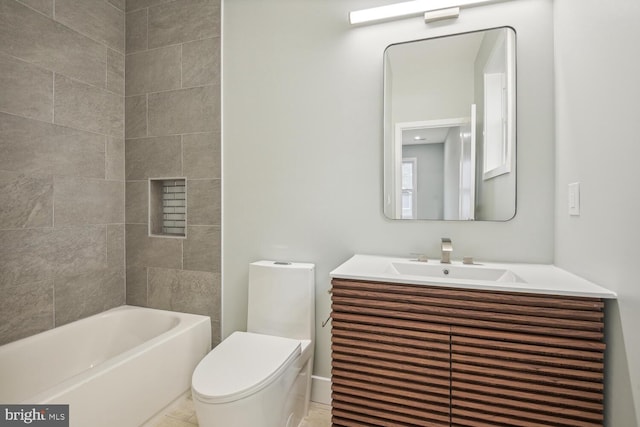 full bathroom featuring vanity, toilet, and tiled shower / bath combo