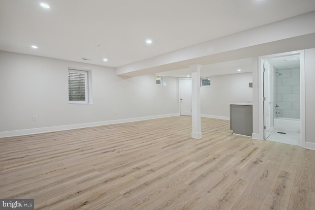 basement featuring light hardwood / wood-style floors