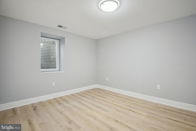 empty room with light hardwood / wood-style floors