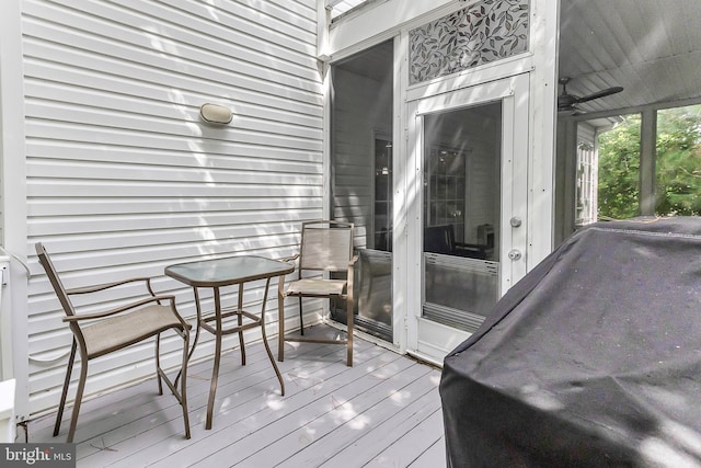 wooden terrace featuring grilling area