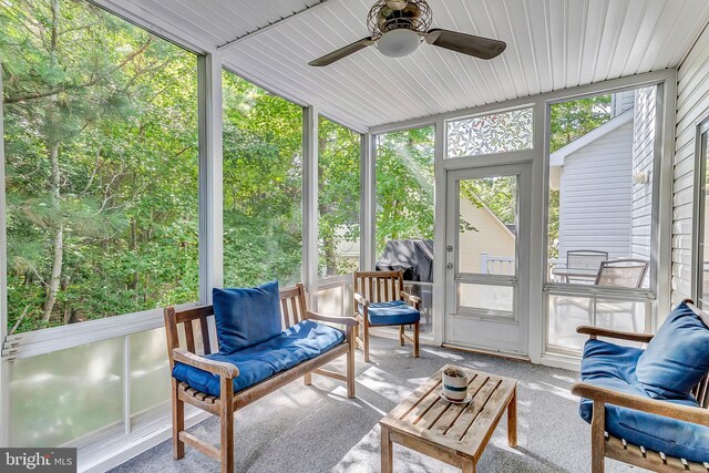 sunroom featuring a wealth of natural light and ceiling fan