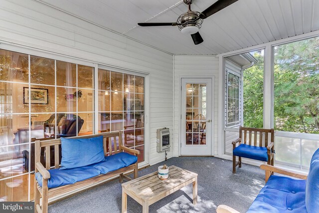 sunroom / solarium with ceiling fan and heating unit