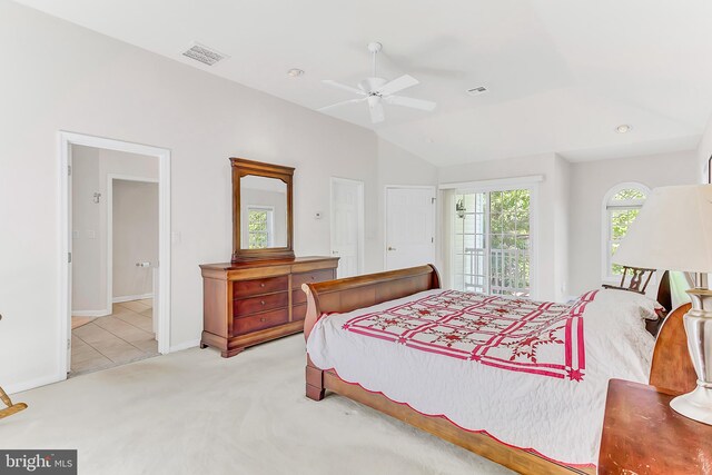 carpeted bedroom with lofted ceiling, access to exterior, ceiling fan, and ensuite bathroom