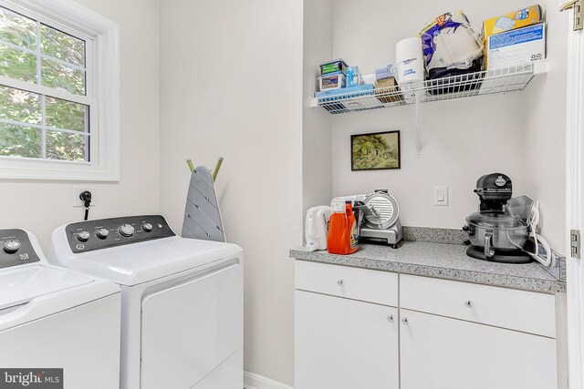 washroom featuring washing machine and dryer