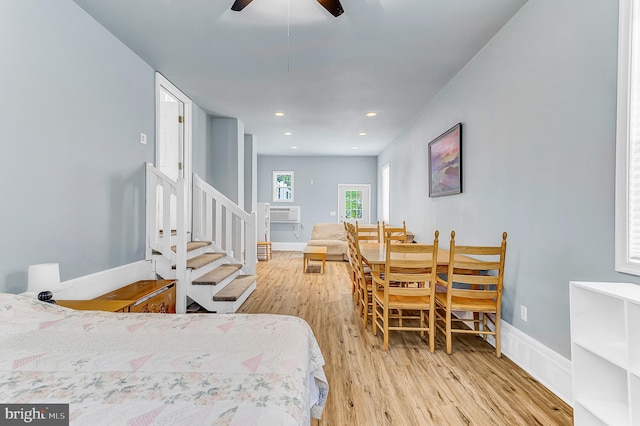 bedroom featuring ceiling fan and light hardwood / wood-style floors