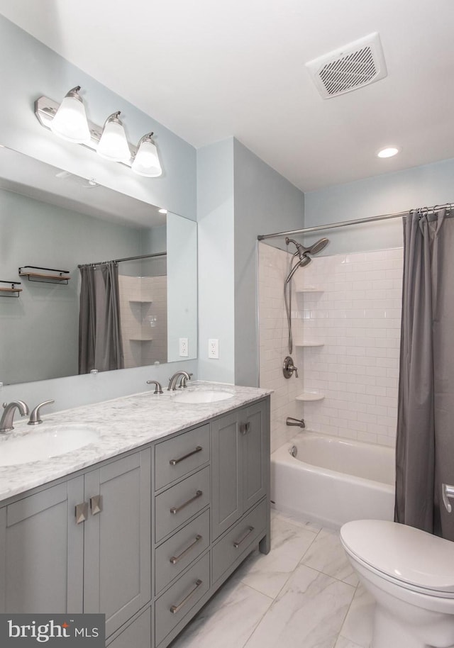 full bathroom with vanity, toilet, and shower / bath combo with shower curtain