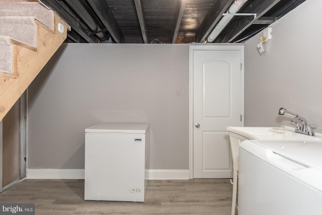 laundry room featuring hardwood / wood-style floors and wooden ceiling