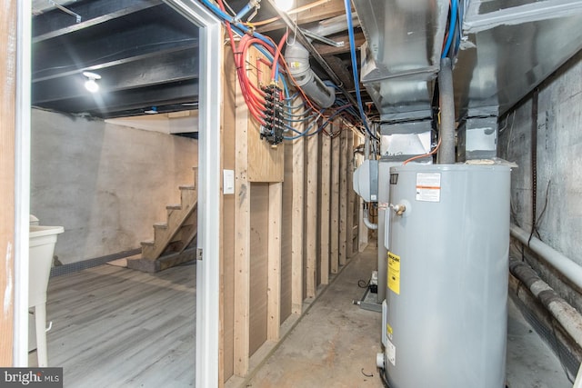 utility room featuring water heater