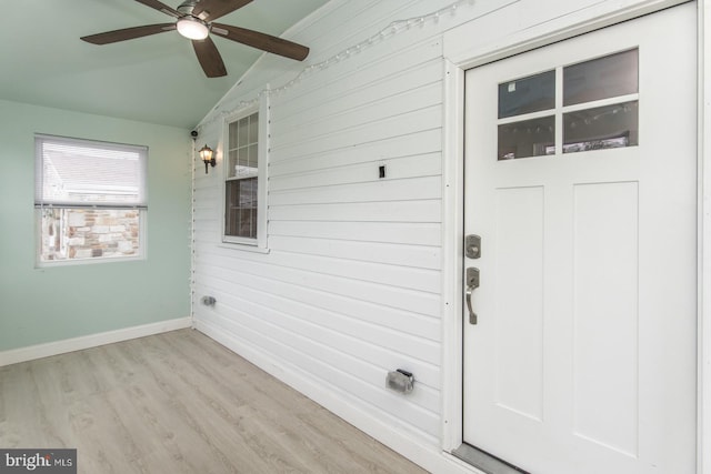 view of exterior entry with ceiling fan