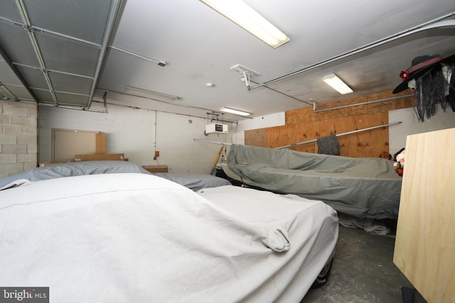 bedroom featuring concrete floors