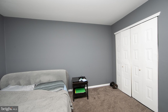 carpeted bedroom featuring a closet