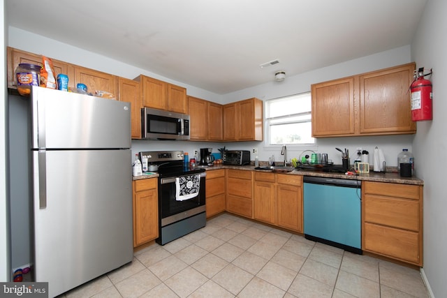 kitchen featuring appliances with stainless steel finishes and sink