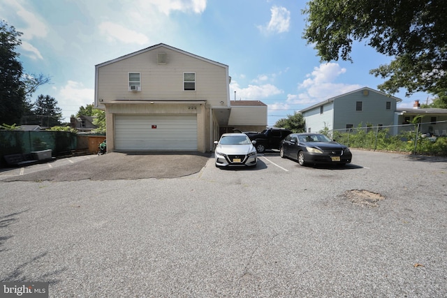 view of side of home featuring a garage