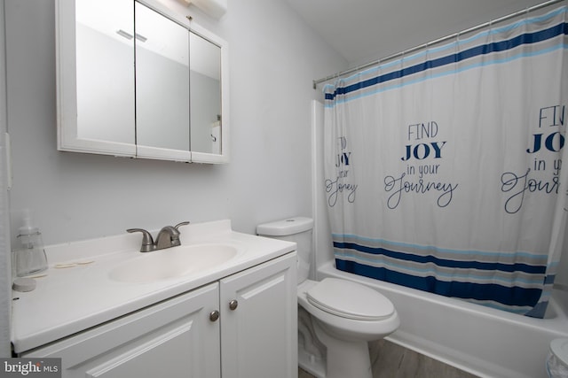 full bathroom featuring vanity, toilet, hardwood / wood-style flooring, and shower / bath combo