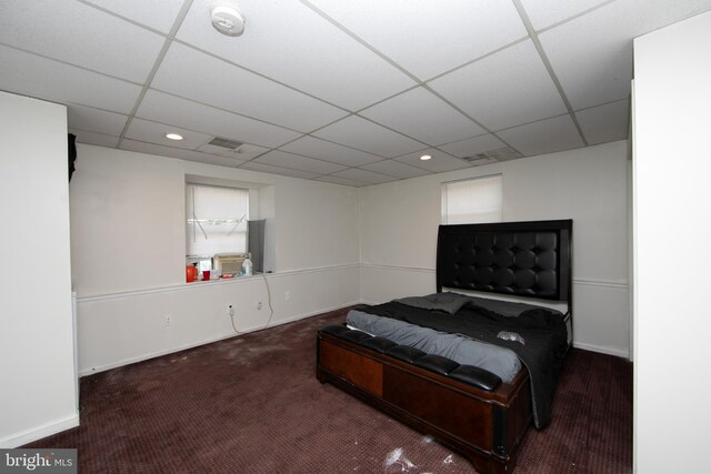 carpeted bedroom featuring a paneled ceiling