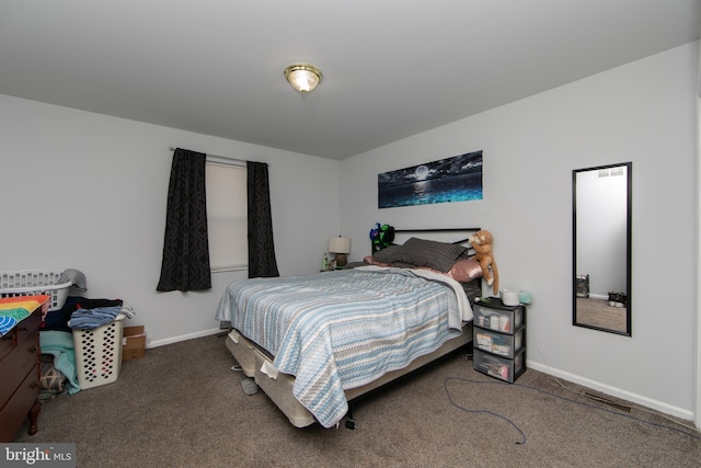 bedroom featuring dark colored carpet