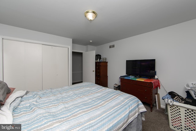 carpeted bedroom featuring a closet