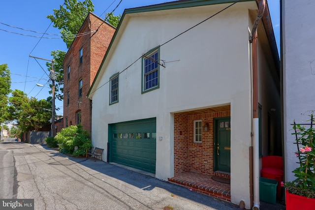 view of side of home with a garage