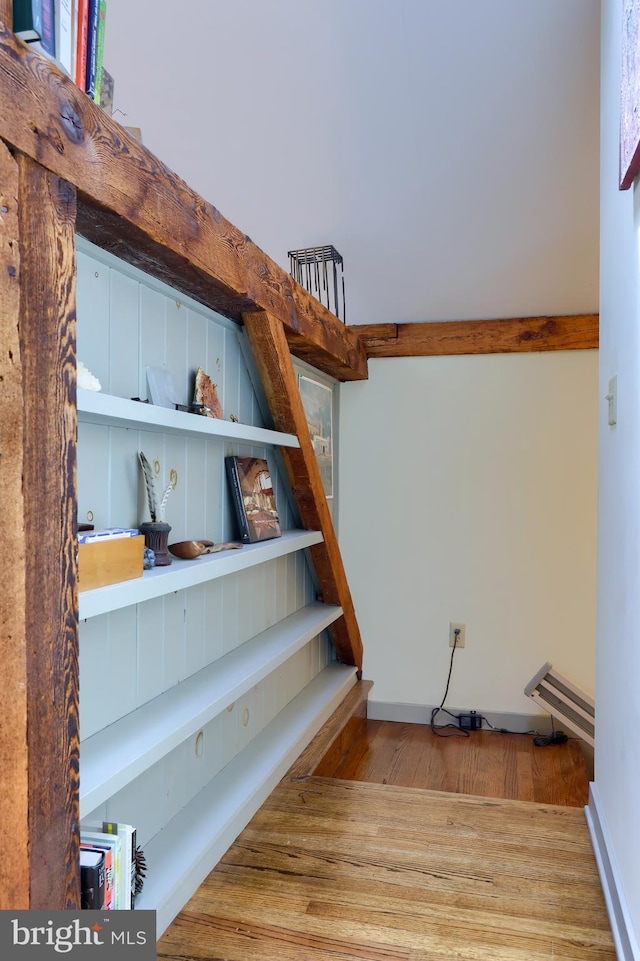 stairs with wood-type flooring