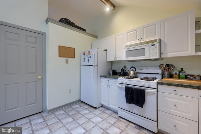 kitchen featuring white appliances, white cabinets, lofted ceiling with beams, and light tile patterned floors