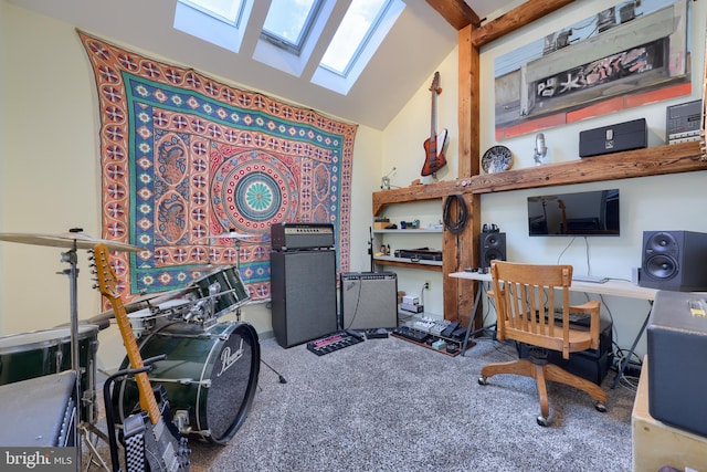 home office with vaulted ceiling with skylight and carpet floors