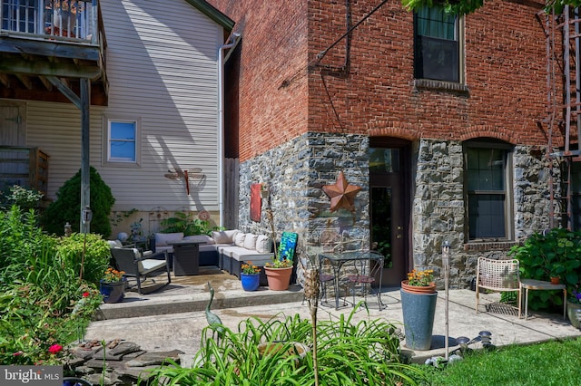 rear view of house featuring an outdoor hangout area and a patio area