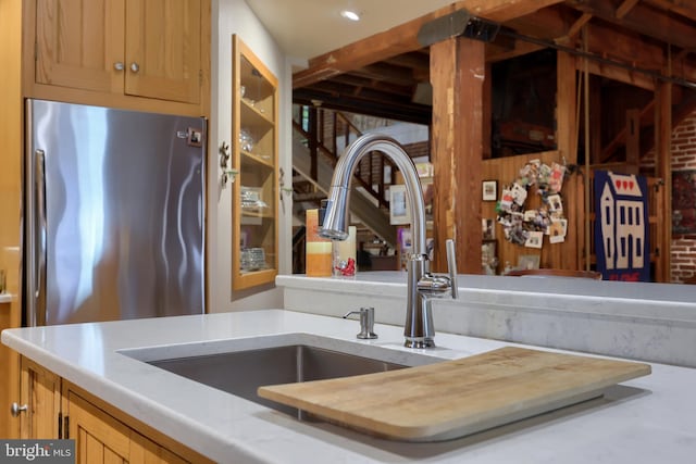 interior details with stainless steel fridge and sink