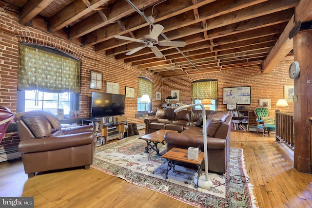 living room featuring ceiling fan, wood ceiling, wood-type flooring, and brick wall