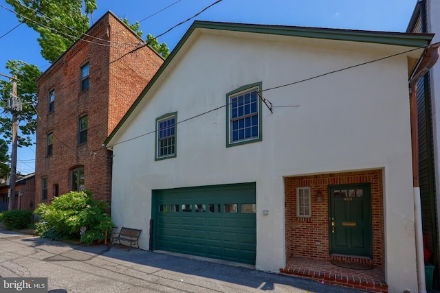 view of side of home with a garage