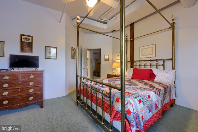 carpeted bedroom featuring a towering ceiling